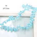 Macro shot of 6x10mm light blue iridescent glass teardrop beads for DIY jewelry making - Sky Blue
