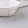 Detailed view of 18K gold plated C-shaped hoop earring on elegant white silk fabric - 35mm / Gold