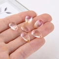 Macro shot of teardrop gradient glass crystal beads for DIY handmade jewelry crafts - Orange Pink