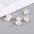 Detailed view of six teardrop pearl charms with gold metal loops for DIY jewelry making - Teardrop Shape (4#) / Pearl White