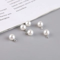 Detailed view of six white faux pearl teardrop pendants with silver bails for DIY jewelry - Silver Bail 8mm Round Bead (7#) / Pearl White