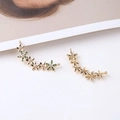 Macro detail of gold plated flower cluster pendant with white and green zircons - 1 Piece / Green Zirconia Flower