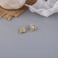 Close-up of golden square stud earrings with pave zircon and DIY hanging loop detail - Square Rhinestone Style (10#)