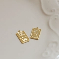 Detailed macro view of 18k gold-plated rectangular Elizabeth II coin pendants on ceramic - Rectangular Portrait (1#)