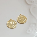 Macro shot of vintage gold-plated DOS PESOS coin charms on white ceramic plate - Round Coin (3#)