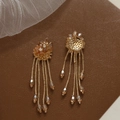 Detail of amber beaded flower earrings featuring crystal tassels and drop pendants - Champagne