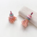 Detail of handmade macaron-colored woven tassels with golden thread for DIY jewelry craft - Style 4