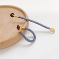 Handcrafted blue and gold Chinese knot cord ring with a brown button fastener detail - Blue & Gold Style (Size #13, Unit Price)