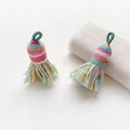 Detailed view of colorful handmade woven tassels with macaron threads and golden silk accents - Style 3