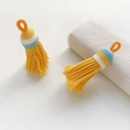 Pair of handmade yellow ethnic woven tassels with orange loops for DIY craft accessories - Style 24