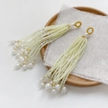Detail of handcrafted cream white pearl tassels with golden thread loops on wooden tray - Single Piece / 4# Pale Yellow Green