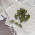 Macro view of vintage green tulip glass beads with golden wire for DIY jewelry making - 6# Green Fish Bead