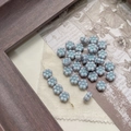Detailed view of light blue daisy glass beads with vintage texture on a rustic wooden frame - 2# 6-Petal Flower - Gray Blue-Edged