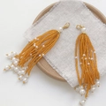 Ethnic beaded tassel pendant with orange glass beads and pearls on wooden tray - Lobster Clasp Style / 20# Orange Yellow