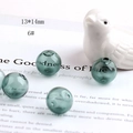 Detailed view of 13x14mm dark green hollow glass beads for DIY jewelry making - Dark Green (6#)