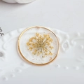 Macro detail of handmade resin pendant featuring yellow dried flower and gold foil flakes - Round Style with Yellow Dried Flowers (5#)