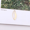 Artistic close-up of irregular golden leaf-shaped hollow metal pendant for DIY jewelry - Irregular Hollow Leaf Pendant (4#)