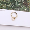 Close-up of golden irregular double-loop metal pendants for DIY jewelry making on white background - Irregular Double Ring Intertwined Pendant (5#)