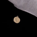 Macro shot of gold vintage coin pendant with relief carving on a dark background - Queen Portrait Round Coin (1#)