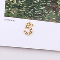 Detailed view of a gold plated number 5 metal pendant with faceted texture for jewelry DIY - Number 5 Geometric Faceted Pendant (12#)