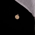 Macro view of golden vintage Liberty coin pendant with relief portrait on black background - 1978 Portrait Round Coin (11#)