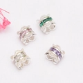 Detailed macro view of 14K gold-plated spacer beads with colorful zircon inlay for DIY jewelry - White Zirconia / Silver Plated (Color Retention)