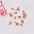 Macro shot of rose gold bead tips with rhombus texture for DIY jewelry making - 4mm / Rose Gold Plated (Color Retention)
