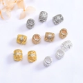 Gros plan de perles évidées plaquées or 14K avec zircons micro-pavés pour bijoux DIY - Or 14 carats / Zircone Blanche