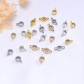 Macro shot of 14K gold and silver gear-shaped CZ zircon connectors for DIY jewelry making - Single Hanger 14K Gold Color Retention / White Zirconia