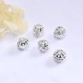 Macro shot of silver hollow cubic zirconia beads on a white silk background for jewelry DIY - 8mm / Silver Plated (Color Retention)