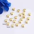 Vista detallada de cuentas espaciadoras planas de 5mm bañadas en oro 14K para joyería - 3mm / Oro de 18K