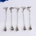 Detail view of 5-piece silver butterfly tassel pendants with lily of the valley bells - White Gold