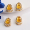 Detailed view of 14K gold gourd charms with orange inlay and zircon pave borders - 14K Gold (Inlaid Yellow)