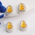 Macro detail of 14K gold filled gourd pendants with amber stones and zircon settings - Silver (Inlaid Yellow)
