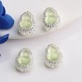 Detail view of 14K gold wulu pendants with green jade inlay and cubic zirconia bezel - Silver (Inlaid Light Green)