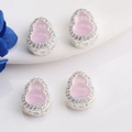 Detailed macro view of 14K gold gourd pendant with pink jade inlay and CZ micro-pave crystals - Silver (Inlaid Pink)