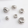 Macro detail of 14K gold filled snake pattern beads with pavé cubic zirconia accents - 6mm / White Gold