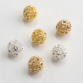 Macro detail of 10mm hollow gold and silver plated beads with intricate floral milgrain texture - Milgrain Flower Style (Style No.8) / 18K Gold 10mm