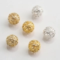 Detailed view of 10mm hollow metal spacer beads with woven texture in gold and silver - Woven Texture Design (Style No.1)