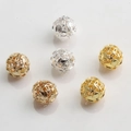 Macro detail of 10mm hollow gold and silver plated beads for DIY jewelry making - Delicate Geometric Pattern (Style No.3)
