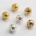 Macro shot of 14K gold and silver hollowed 10mm geometric patterned spacer beads - Geometric Dot Texture (Style No.12)