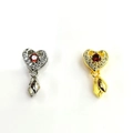 Close-up of 18k gold heart pendants with red rubies and sparkling zircon stones - 18K Gold / Red Main Stone Heart-Shaped Style (Style A001)