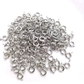 Polished silver spring ring clasps for jewelry making in bulk on white background - Spring Clasp 7mm / White Gold