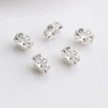 Macro detail of five silver 14K gold-filled spacers with sparkling zircon for DIY bracelets - 12mm Large Hole Spacer Bead / Silver Plated (Color Retention)