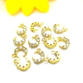 Macro shot of 14K gold-plated crescent moon charms with micro-pave cubic zirconia - 18K Gold Single Loop Moon