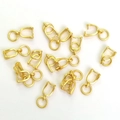 Bélières dorées en forme de fleur pour la création de bijoux DIY sur fond blanc - Bails à Pince