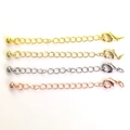 Detail view of four-color lobster clasps and extension chains for DIY jewelry making - Sphere