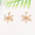 Macro view of 14K gold plated flower charms with cubic zirconia for DIY jewelry making - Marquise Zirconia Flower Pendant