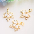 Macro shot of 14K gold-filled maple leaf pendants with micro-pave cubic zirconia details - 14K Gold Color (White Zirconia Maple)