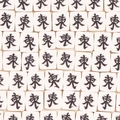 Flat lay of ivory white mahjong beads with black East Wind engraving for DIY jewelry - East Wind